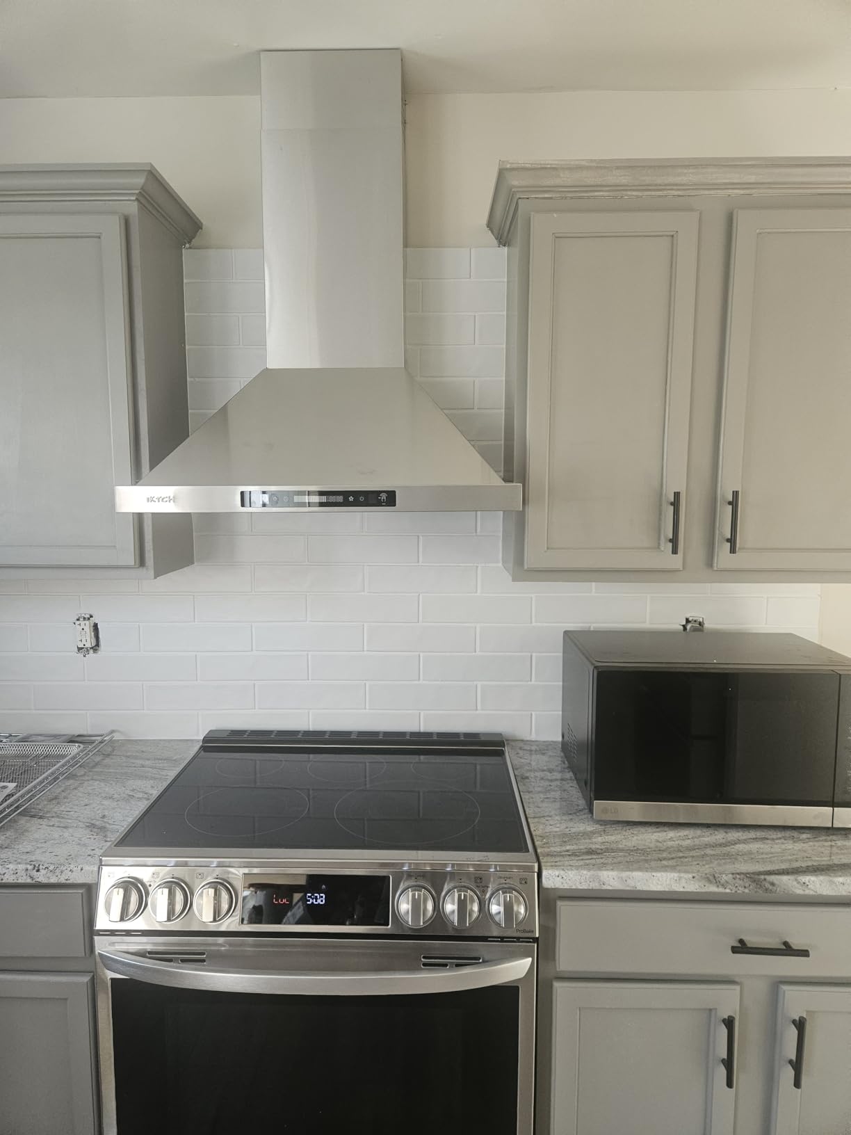 IKTCH 30-inch Wall Mount Range Hood 900 CFM Ducted/Ductless Convertible, Kitchen Chimney Vent Stainless Steel with Gesture Sensing & Touch Control Switch Panel, 2 Pcs Adjustable Lights(IKP02-30'') customer photo 1