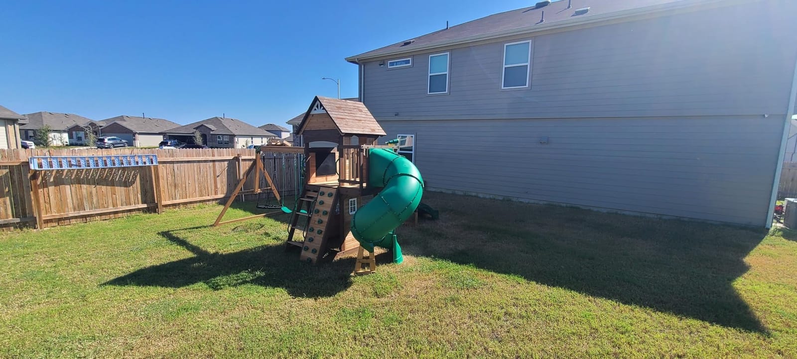 Backyard Discovery Cedar Cove Cedar Wood Swing Set with Spiral Tube Slide, Wave Slide, Clubhouse, Toy Grill, Snack Bar, Rock Wall, Belt Swings, Web Swing, Balcony, Chalkboard, Ladder, Outdoor Playset customer photo 2